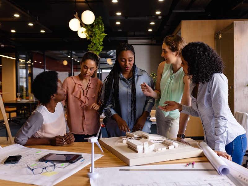 diverse-female-architects-in-discussion-using-mode-2025-04-03-22-27-07-utc